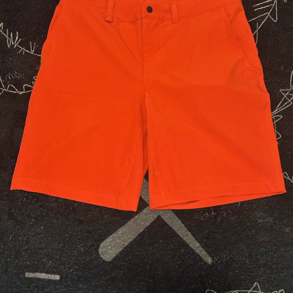 The North Face Flat Front Shorts in Vibrant Orange